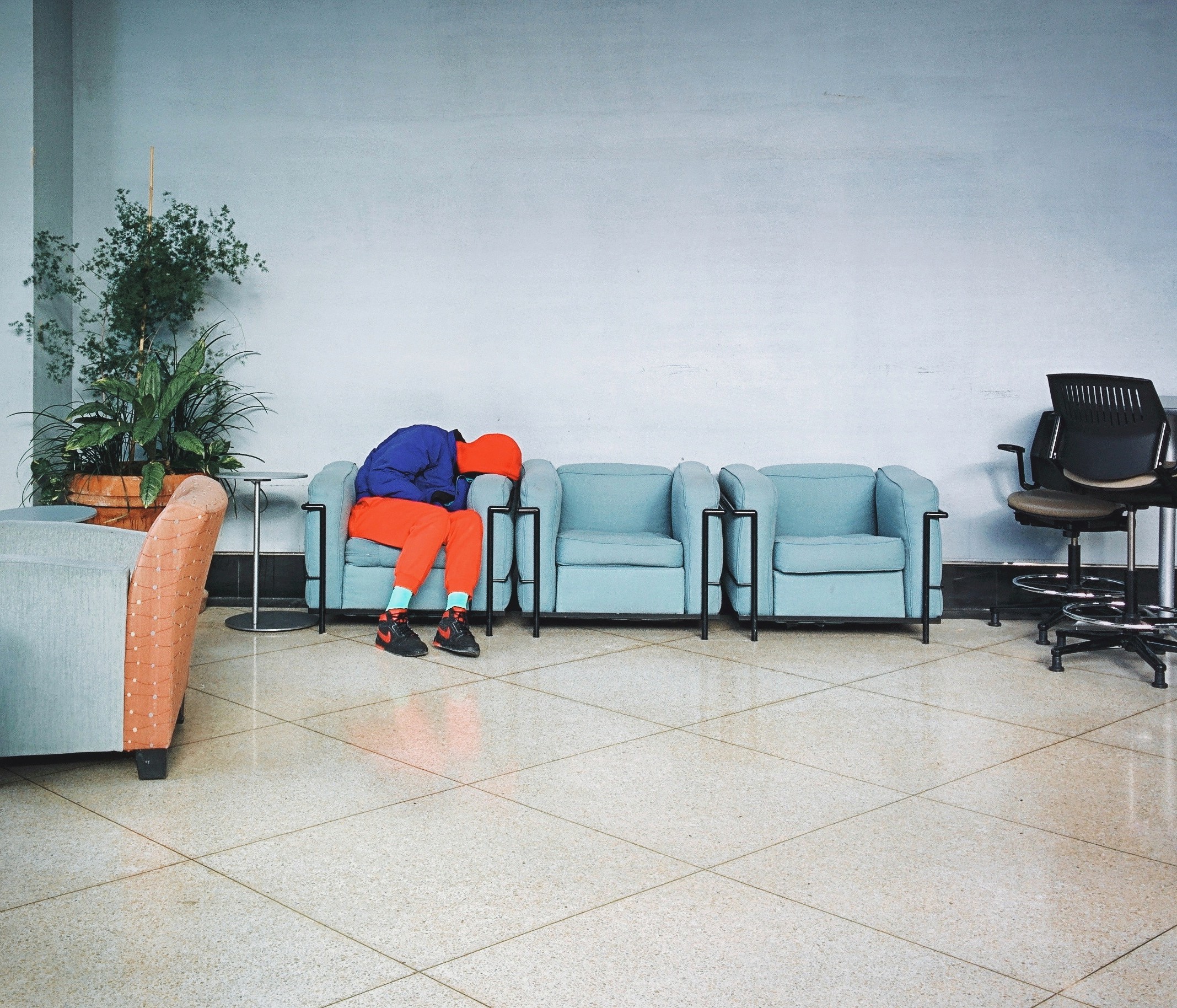 Person sleeping on a chair